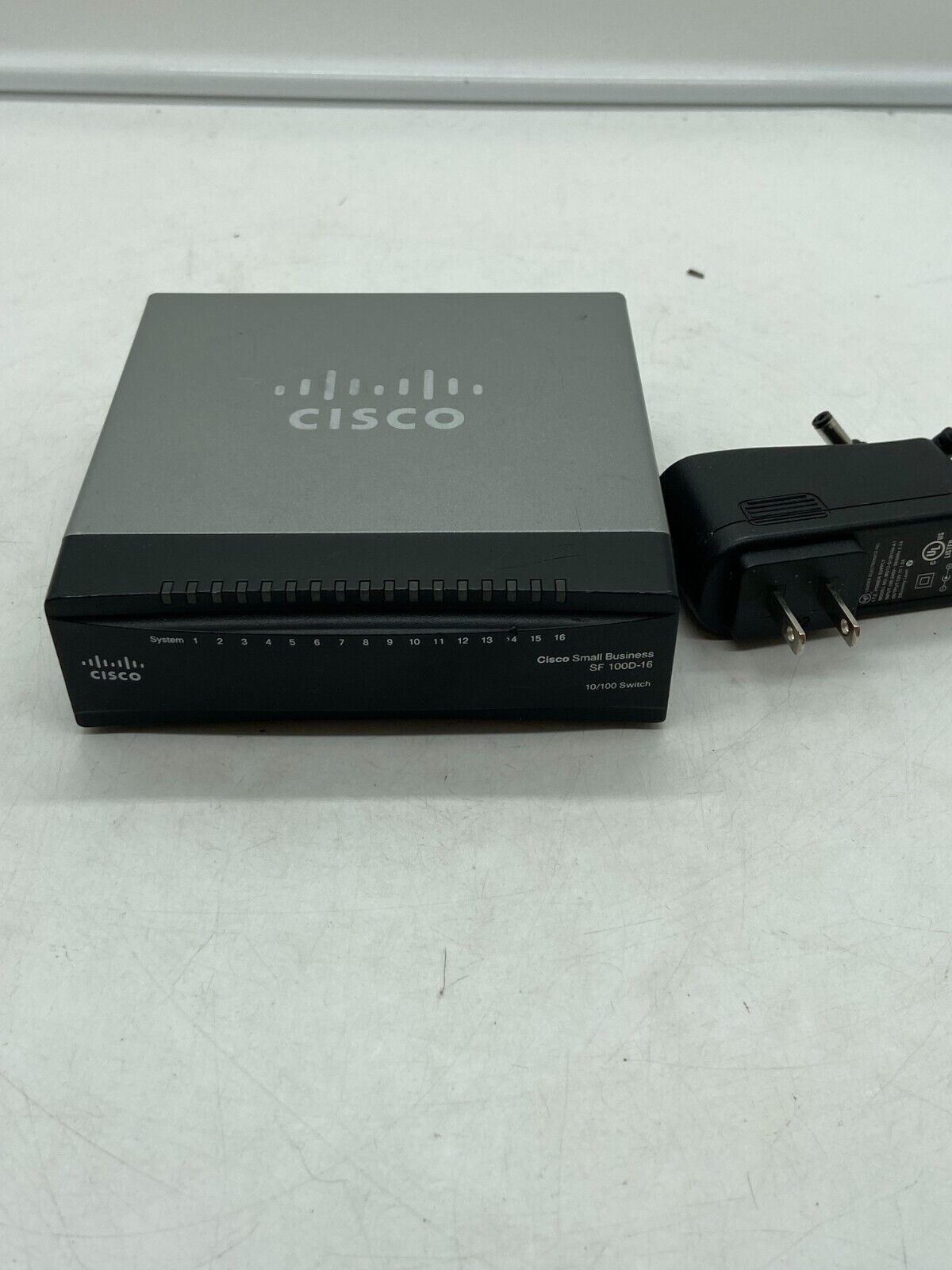 Cisco SF100D-16 16-Port Desktop 10/100 Switch w/ Power Adapter 